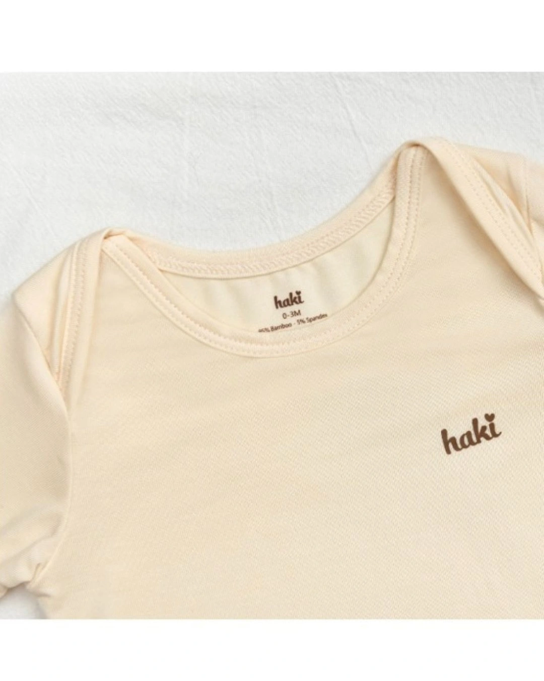 Bodysuit tay dài Haki BB044 màu kem 3