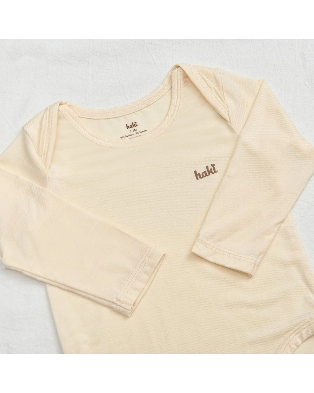 Bodysuit tay dài Haki BB044 màu kem 2